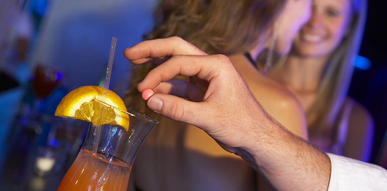 Person spiking another persons drink