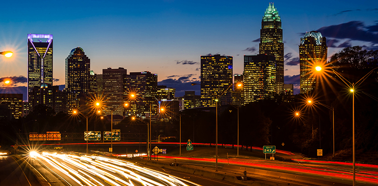 Charlotte city at night, cars on highway