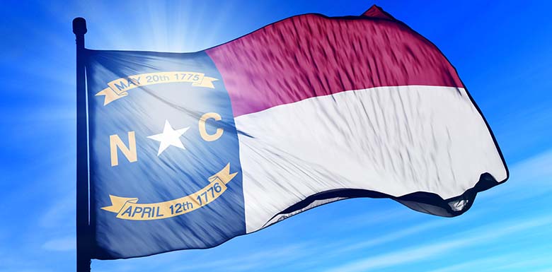 North Carolina flag on blue sky